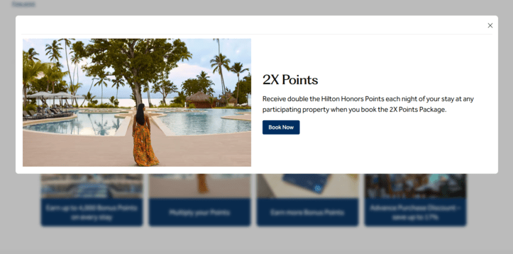 Hilton Honors "2X Points" popup at a beach resort, with thumbnail offers for bonus points, multipliers, and an advance purchase discount